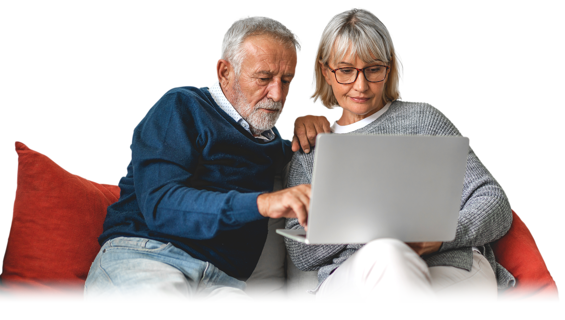 Photograph of an older, Caucasian couple on a couch reading online about the BLISSc-ILD Study and systemic sclerosis.